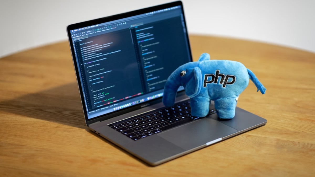 blue elephant figurine on macbook pro