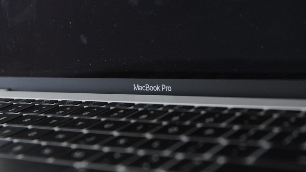 a close up of a macbook pro on a table