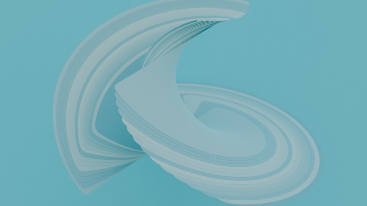 a stack of white paper sitting on top of a blue surface