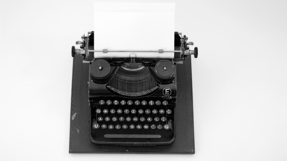 black and white typewriter on white table