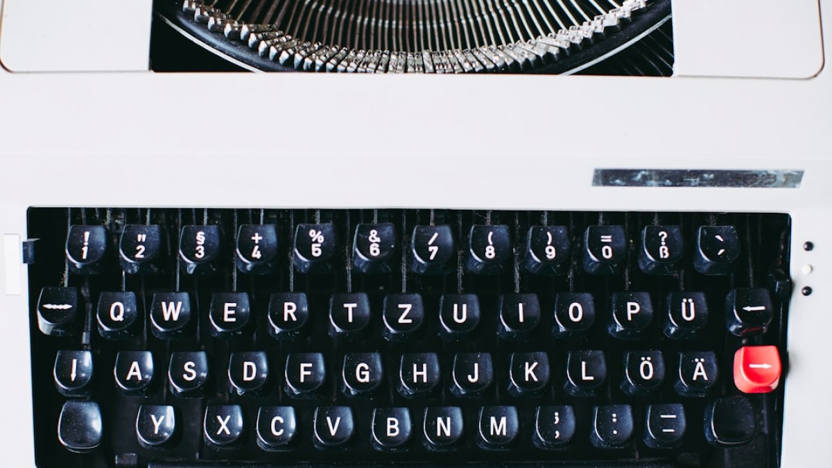 black and white typewriter on white table